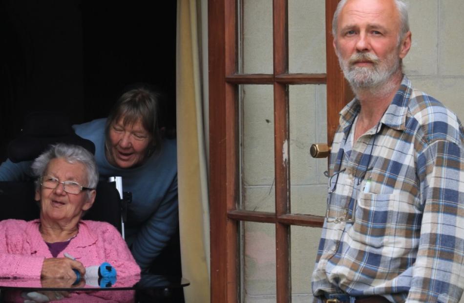 Ioan Grigore and his wife Riane de Koster (behind chair) began caring for Mr Grigore's mother,...