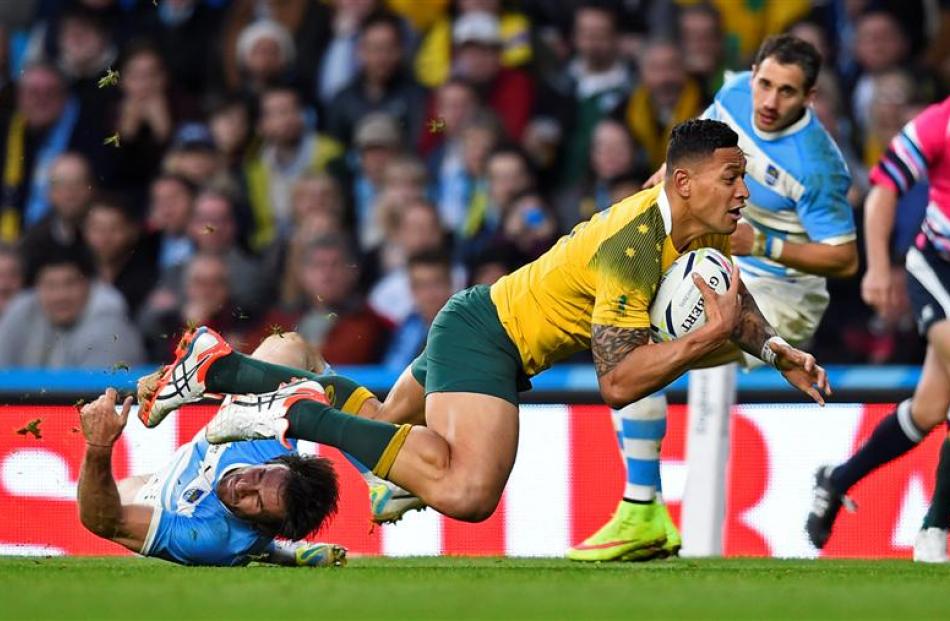 Israel Folau scores a try against Argentina during their World Cup semifinal. Photo: Reuters