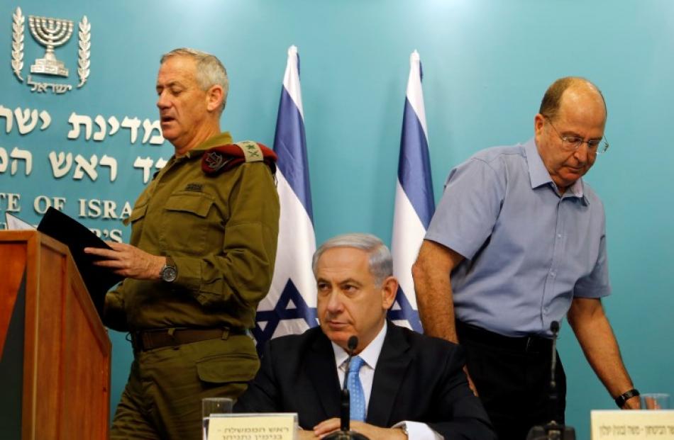 Israel's Prime Minister Benjamin Netanyahu (C), Israeli military chief Lieutenant-General Benny...