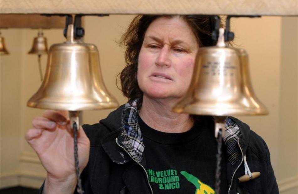 Jai Hall with her bells that are bound for woolsheds around the country to honour the...