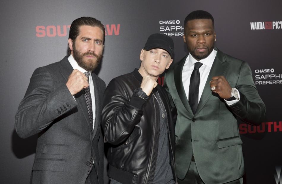 Jake Gyllenhaal, Eminem and Curtis '50 Cent' Jackson attend the premiere of "Southpaw" in New...