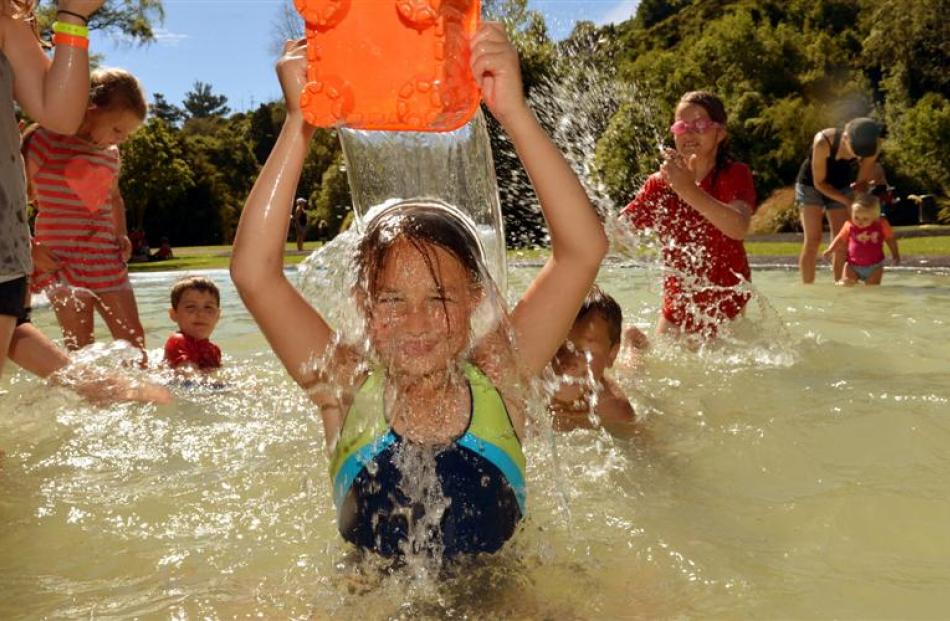 Jalizza Cockburn (9) enjoys a dip in the Woodhaugh Gardens pool yesterday along with a throng of...