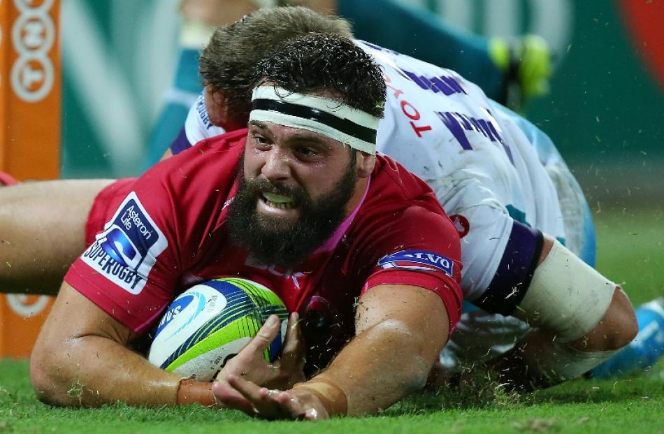 James Hanson of the Reds scores a try during the round four Super Rugby match between Queensland...