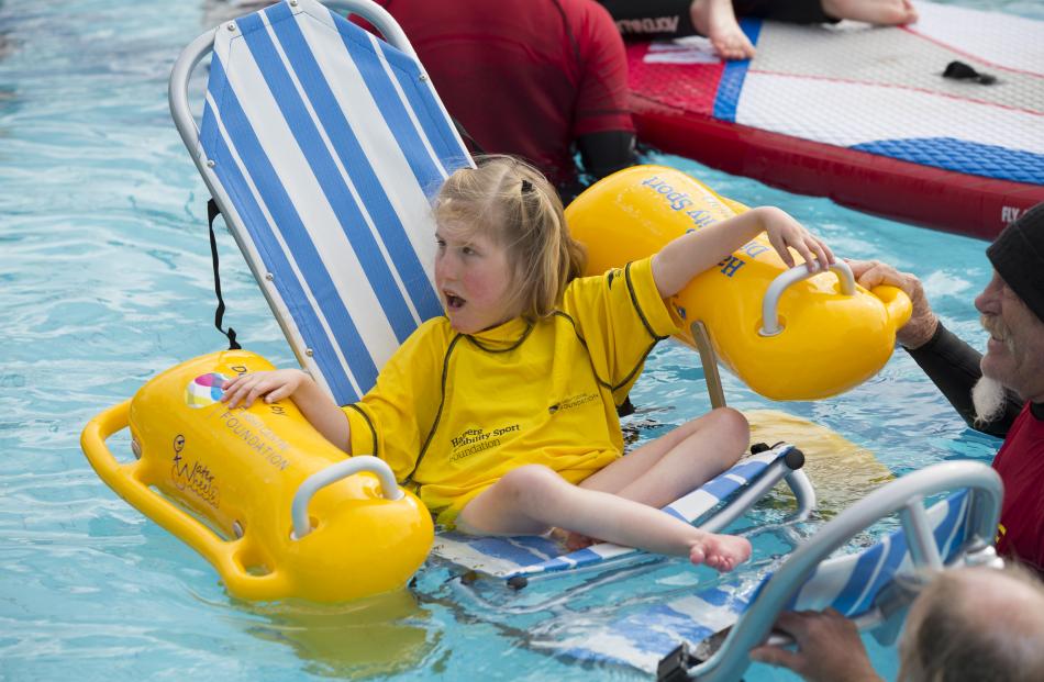 Jamie McEwen enjoys a swim in the pool during last year's Flight Centre Foundation Halberg Surf...