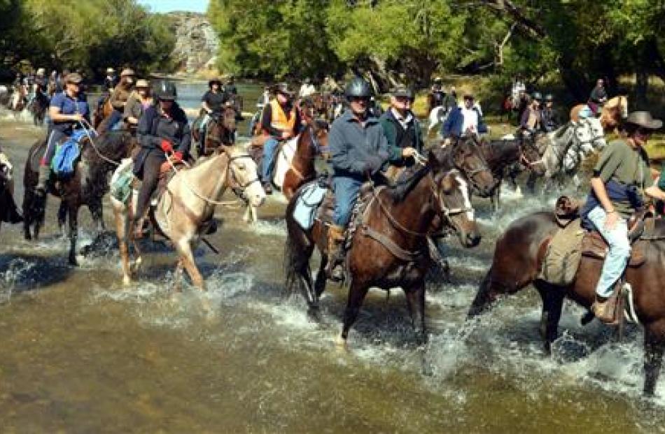 Jane Whitmore's Moonlight Wanderers Goldfields Cavalcade trail crosses the Taieri River, near...