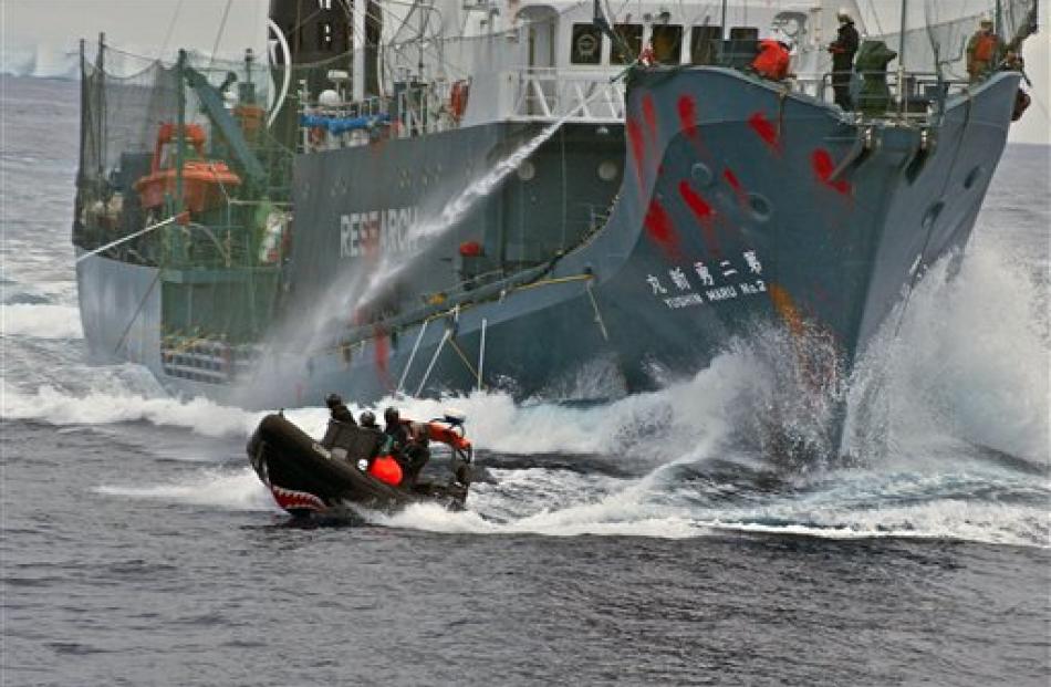 Japanese whaling vessel Yushin Maru No. 2 shoots its water cannons at the Sea Shepherd crew on a...