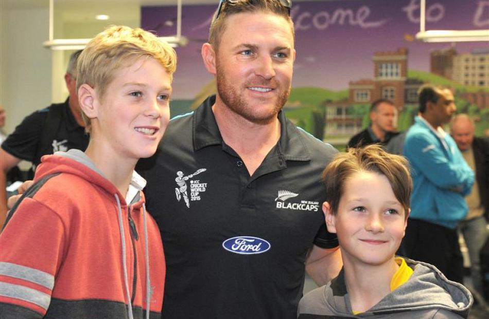 Jared (left, 11) and Thomas (9) Gibson, of Mosgiel, with Black Caps skipper Brendon McCullum  at ...