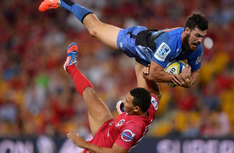 Jayden Hayward of the Force collides midair with Jonah Placid of the Reds during the round eight...