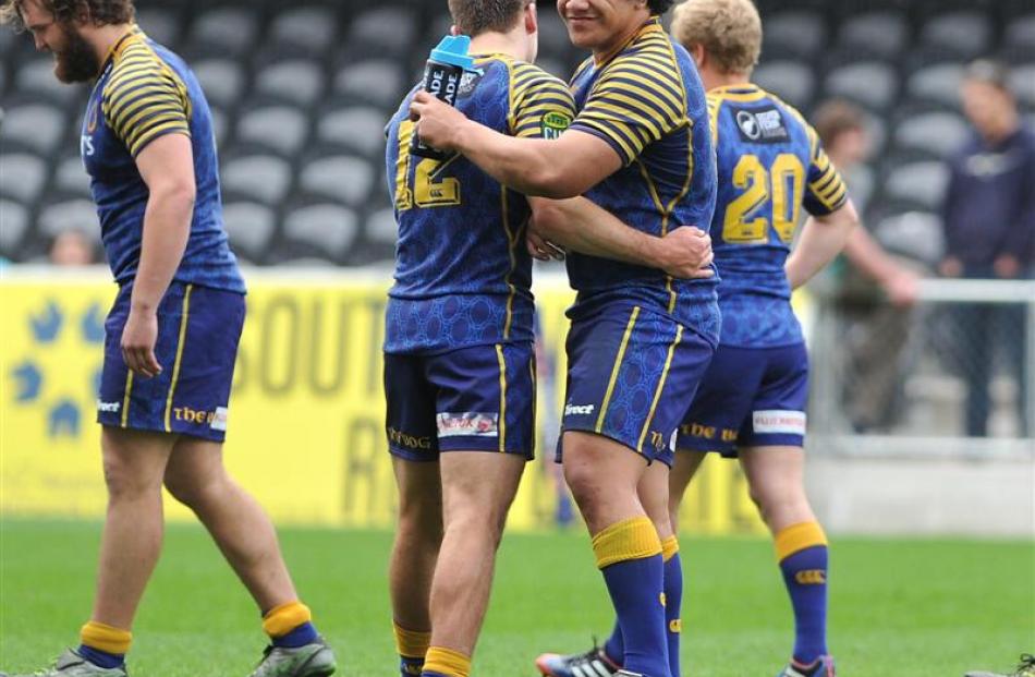 Jayden Spence and Aki Seiuli congratulate each other. Josh Renton is in the background, with Liam...