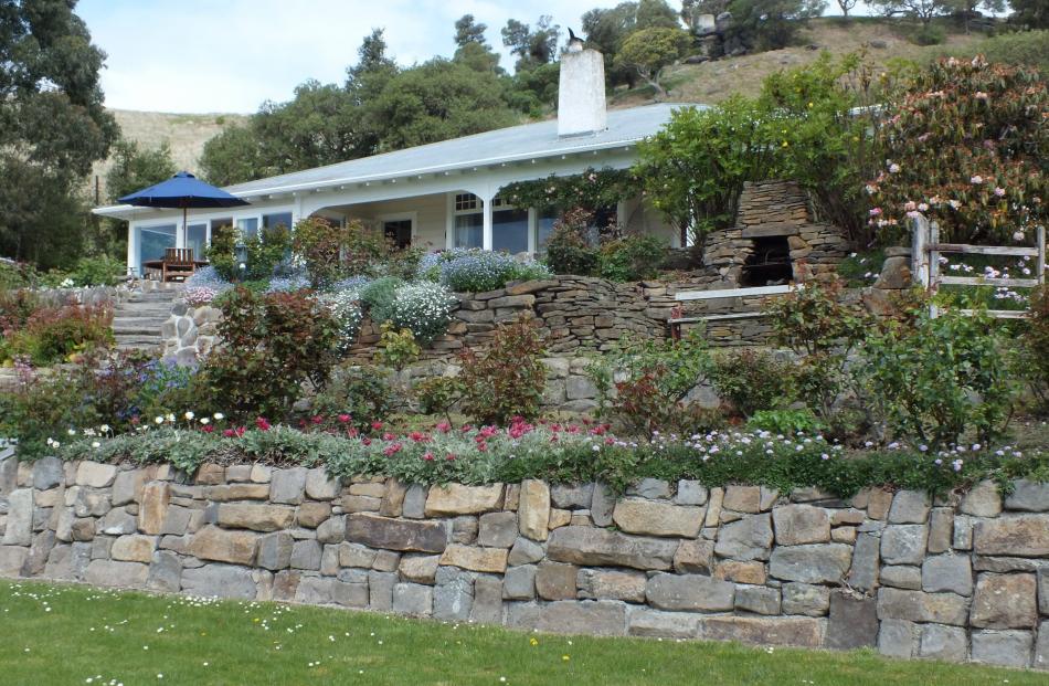 Jeff Matheson built the stone walls between the house and the tennis court. Photos by Gillian Vine.