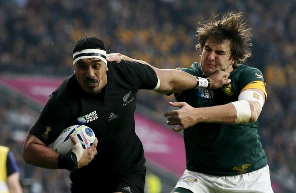 Jerome Kaino fends off Lodewyk de Jager during the All Blacks semifinal win over South Africa....