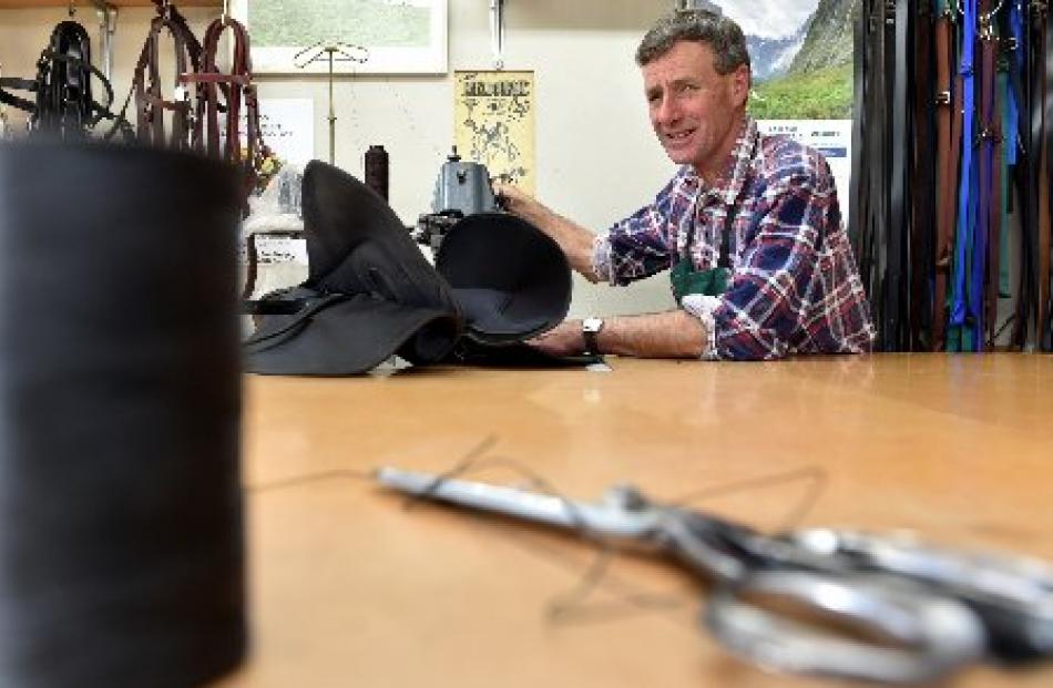 Jim Burns at the sewing machine in his workshop at Wingatui.