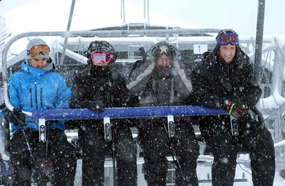 People enjoying the slopes as snow finally falls on the ski fields around Queenstown.