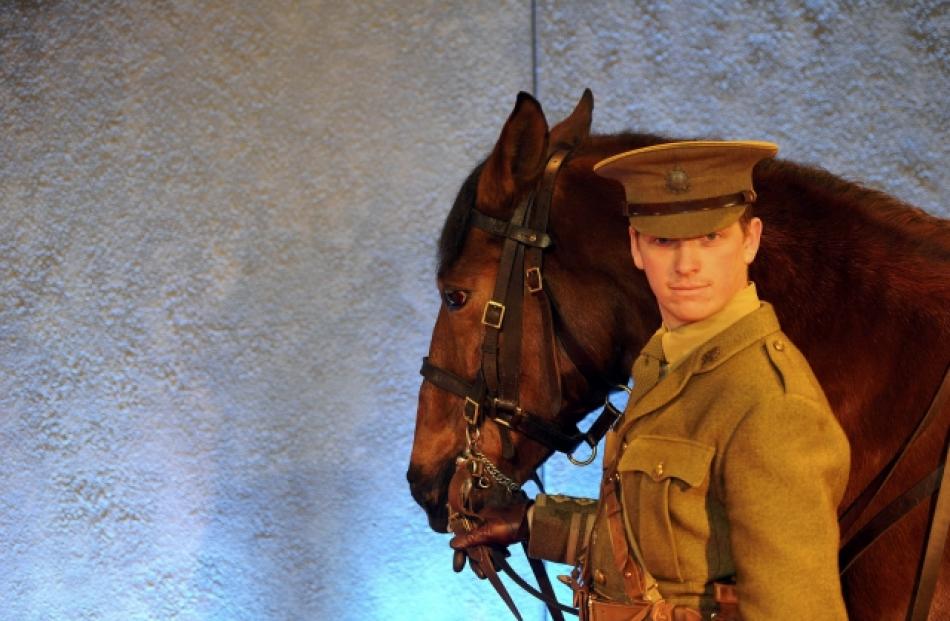 Joey, the equine star of the film 'War Horse' is led by a handler at the UK premiere in London....