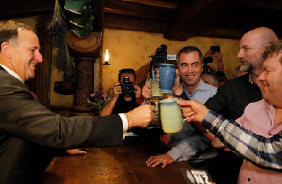 John Key, accused of having a 'taste for celebrity', shared a beer with actors from The Hobbit...