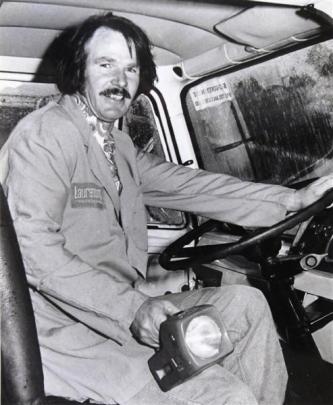 John Spain with the flashlight he used to signal for help. Photos from ODT files.