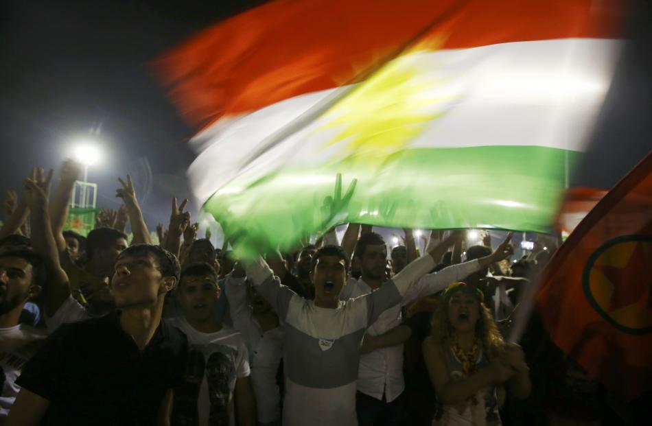 Jubilant Kurds celebrate in the south-eastern city of Diyarbakir. Photo: Reuters