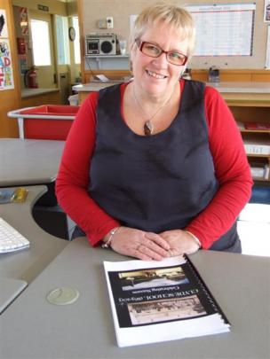 Jubilee convener Sally Bell with a proof copy of the book she has compiled for the Clyde School's...