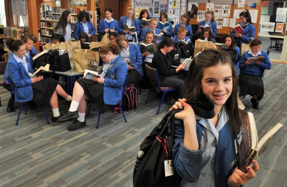 Judah Kelly (13), of Queen's High School in Dunedin,  breaks out  her summer book bag with...