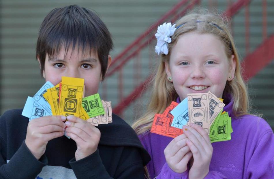 Kaikorai Primary School pupils (from left) Sean Kerr (9) and Victoria Dearden (11) with some of...