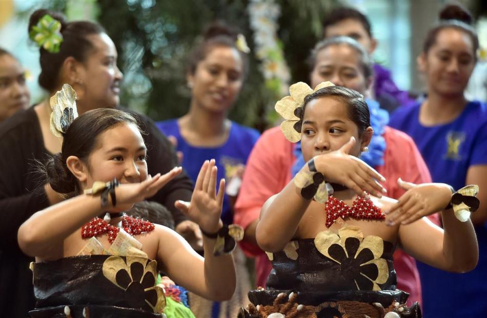 Kakala Pole (left, 8) and Stephanie Lihau (9), both of Dunedin, were part of the official welcome...