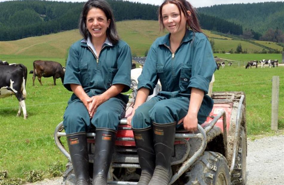 Kara-Lee Clark (left) and Ashleigh McKechnie make up an all-female crew on a dairy farm near...