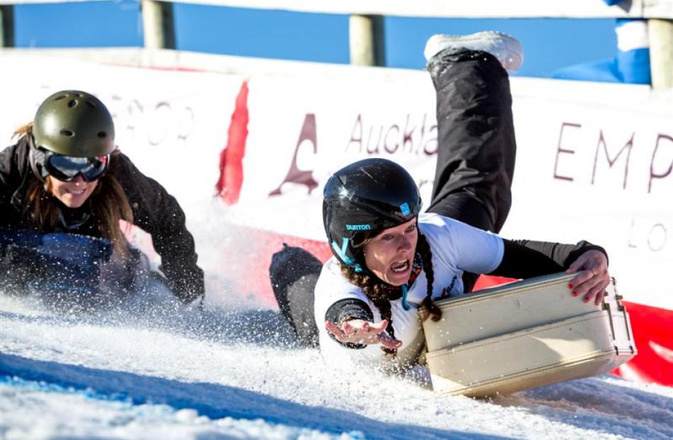 Karina Page, of Queenstown, shows how she hung on to win the women's section of the suitcase race...