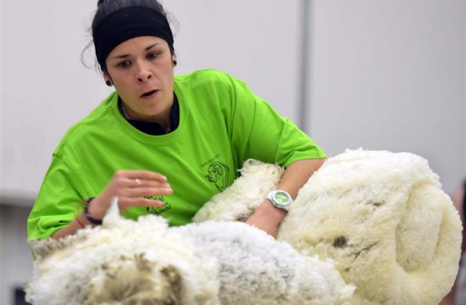 Kelly Macdonald, of Hawea Flat, rolls a fleece during a wool-handling heat of the NZ Merino...