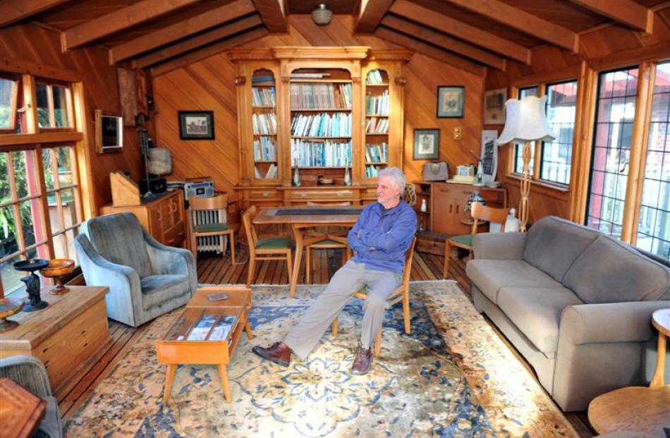 Kevin Hayward reflects on his career, seated in a wood-lined room he helped build above his...