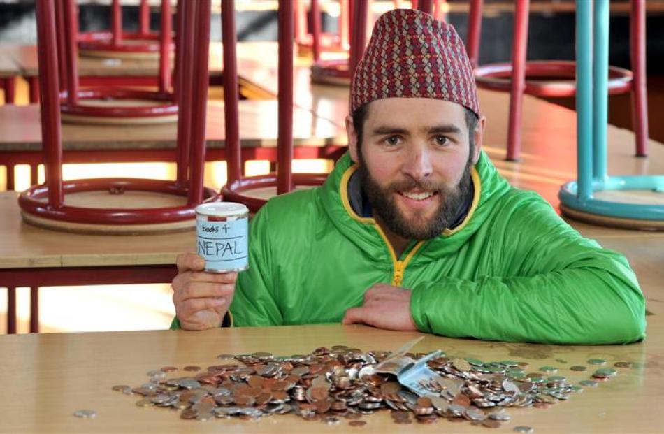 King's High School chemistry teacher Anthony Rodger with the loose change he has collected so far...