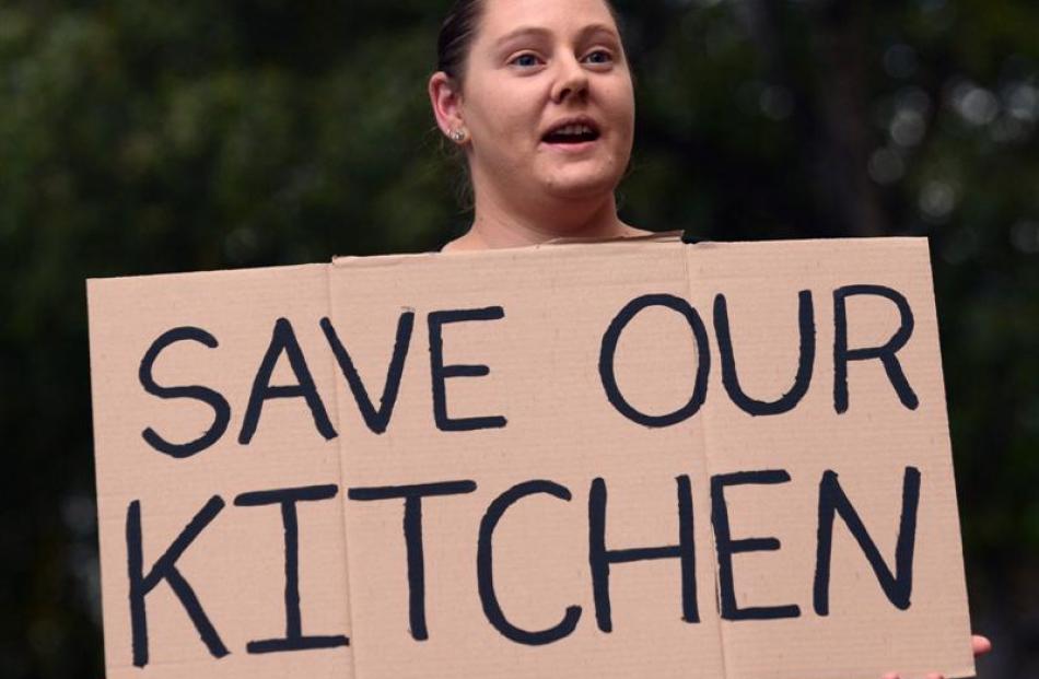 Kitchen worker Karen Phillips attends a protest march on Tuesday against the outsourcing proposal...