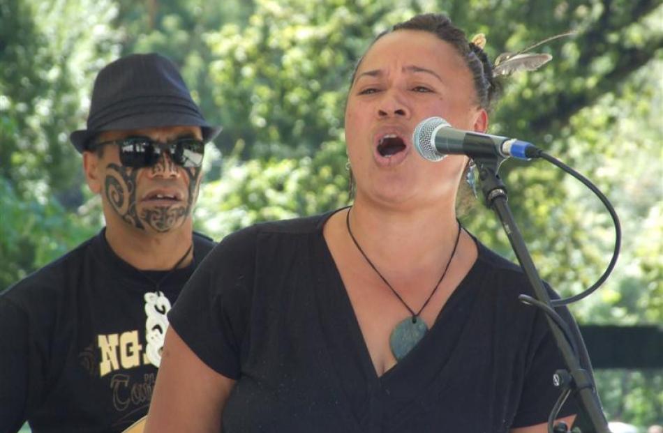 Kiwi Haka performers Liz Davis (front) and Ned Webster, both of Queenstown, entertain residents...