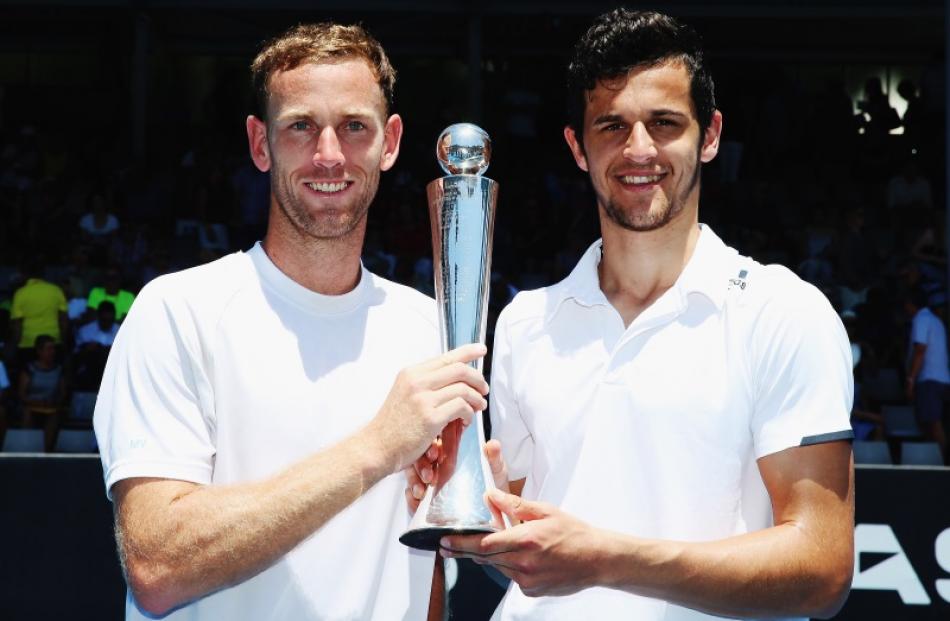 Kiwi Michael Venus (L) and Mate Pavic hold up the Men's Doubles trophy are winning the final at...