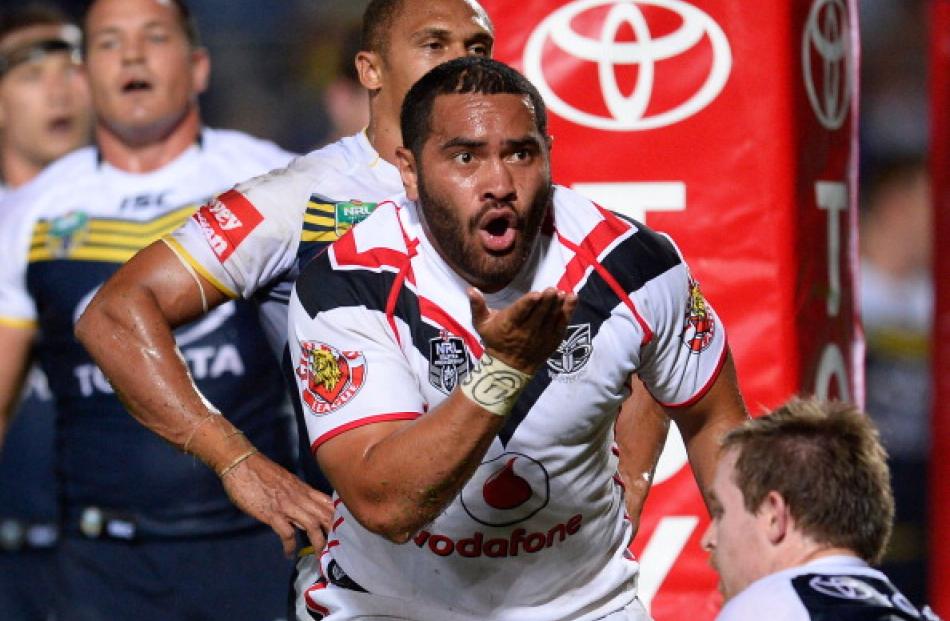 Konrad Hurrell of the Warriors blows a kiss after scoring a try.  (Photo by Ian Hitchcock/Getty...