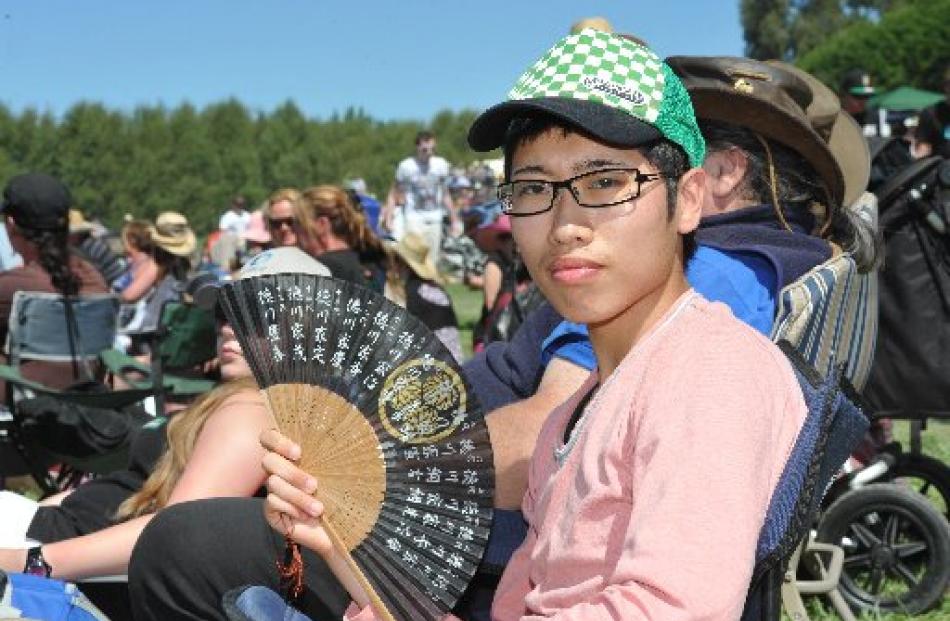 Kyohei Takehisa, of Japan, keeps cool while watching the Outram Rodeo yesterday.