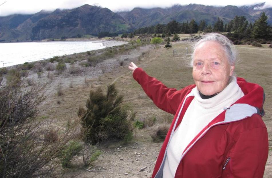 Lake Hawea resident Barbara Chinn points towards the area where a place surveyed many years ago...
