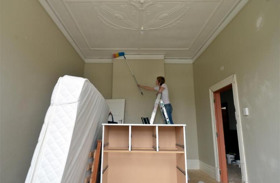 Landlady Fiona Partridge does some dusting in preparation for painting this week.