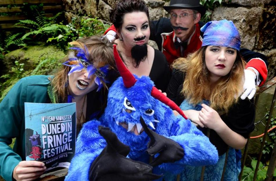 Launching the 2013 Fringe Festival programme in a Dowling St alleyway last night are (from left)...