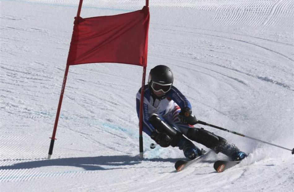 Laurie Taylor (12) takes a giant slalom gate during the combi race at the Otago Daily Times...