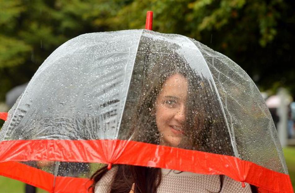 Law and accounting student Deborah Magee (above left), of Christchurch, is ready for the wet...