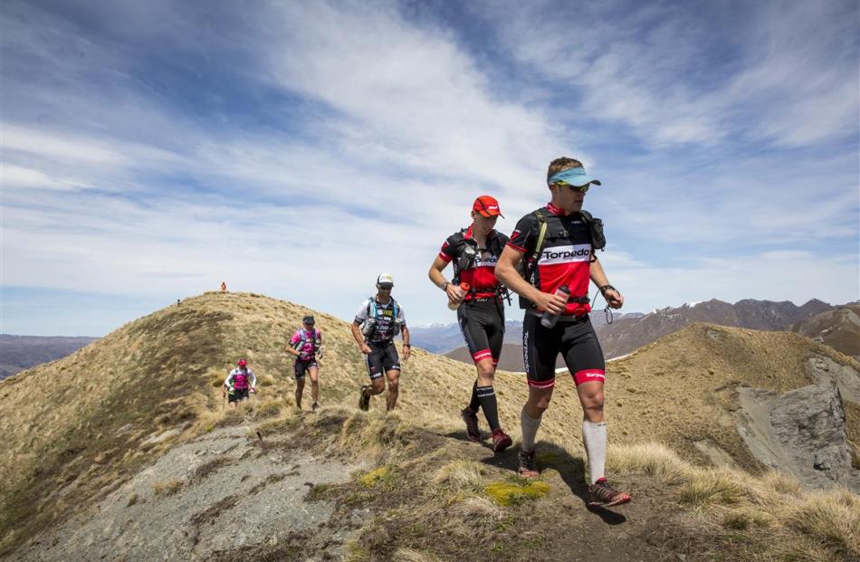 Leading a pack of athletes on the final stage of Red Bull Defiance in 2014 is Queenstown-based...
