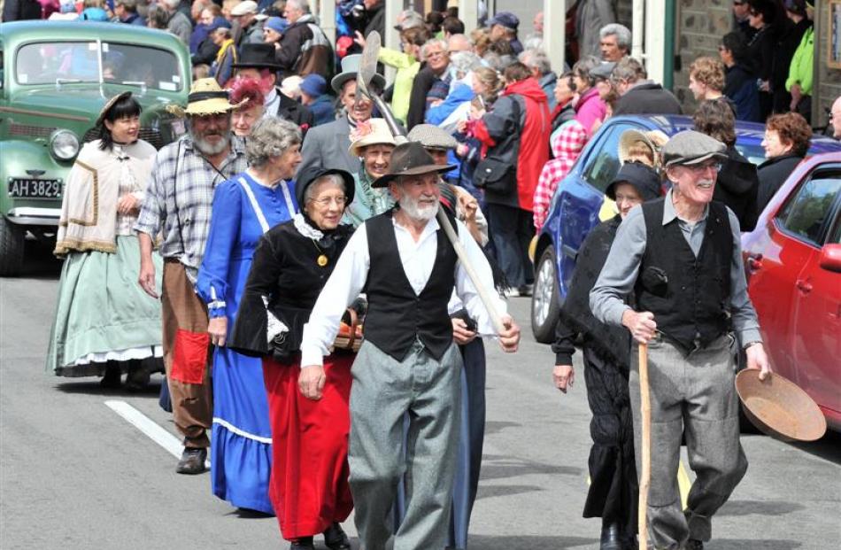 Leading the miners walking are Don Morrison (left) with shovel, of Earnscleugh, and Max O'Leary,...