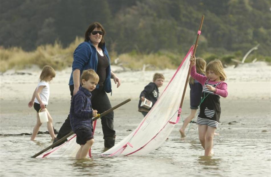 Learning about whitebaiting with their teacher Trudy Pankhurst at Taieri Mouth on Thursday are ...