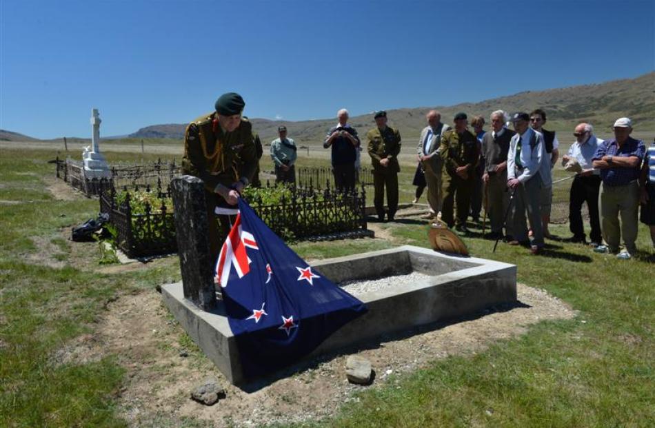 Lieutenant-general Rhys Jones unveils a plaque on the grave of Charles Risk, a World War 1...