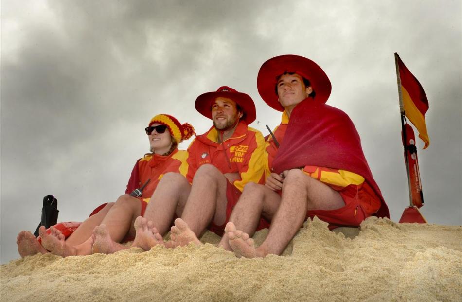 Lifeguards rugged up on Dunedin’s St Kilda Beach yesterday are (from left) Ashlie Nobilo, Tony...