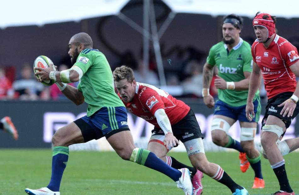 Lima Sepoaga of the Highlanders about to get tackled by Alwyn Hollenbach during the Super Rugby...