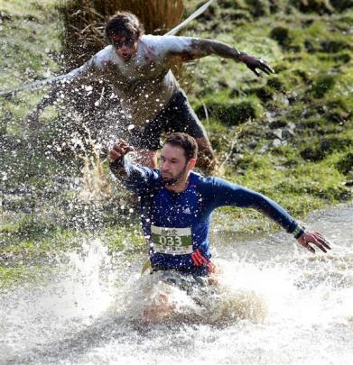 Live human Rob Boyd, of Dunedin, is chased by zombie Nick Williamson, of Dunedin, during the...