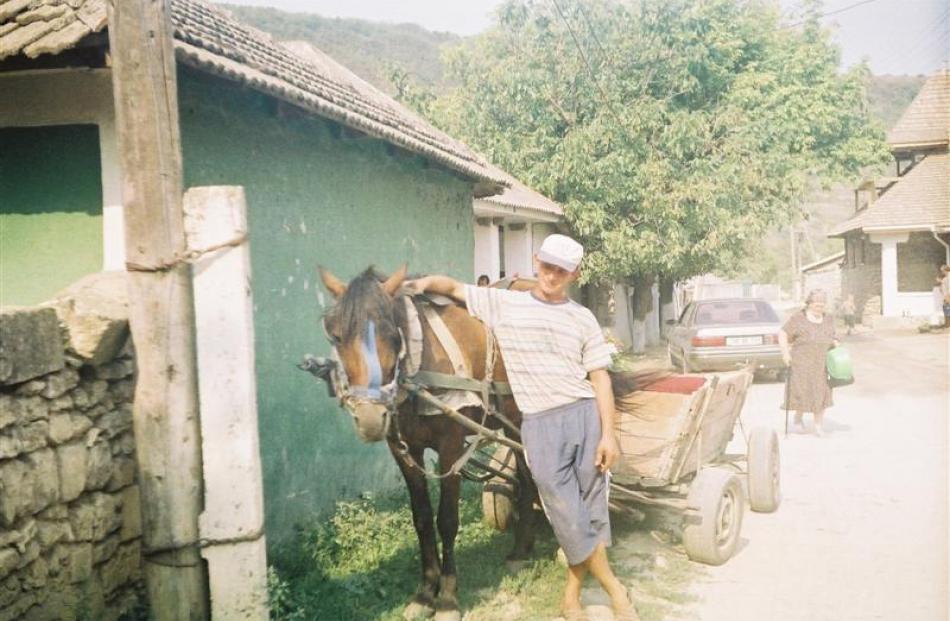 Loads are pulled by a cart horse at the village of Trebujeni.