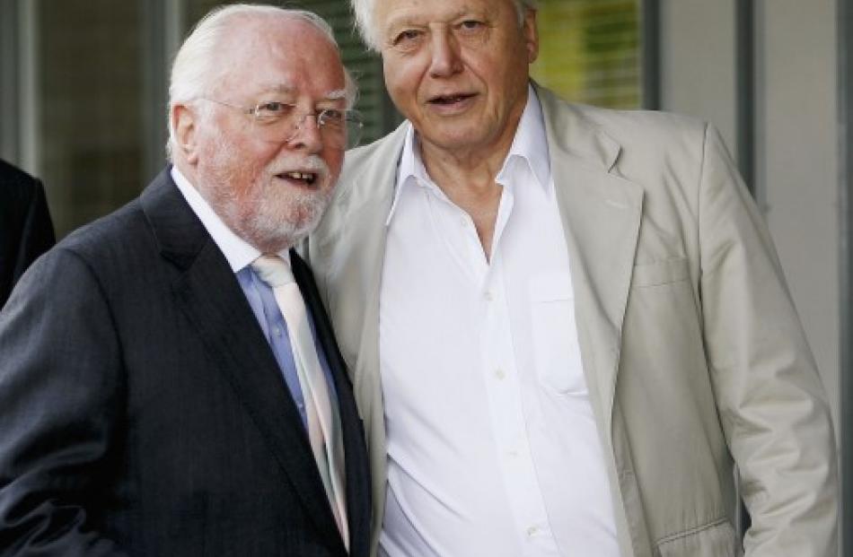 Lord Richard Attenborough (L) and his brother Sir David Attenborough pose before being awarded...