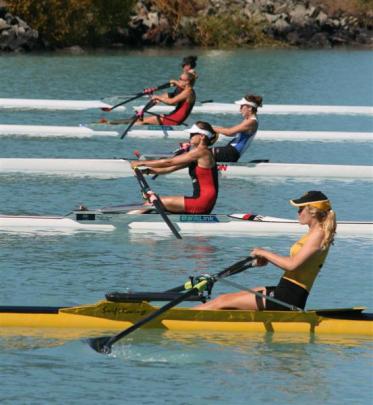 Lucy Strack (North End), in lane four in red and black,  in action in the women's open...